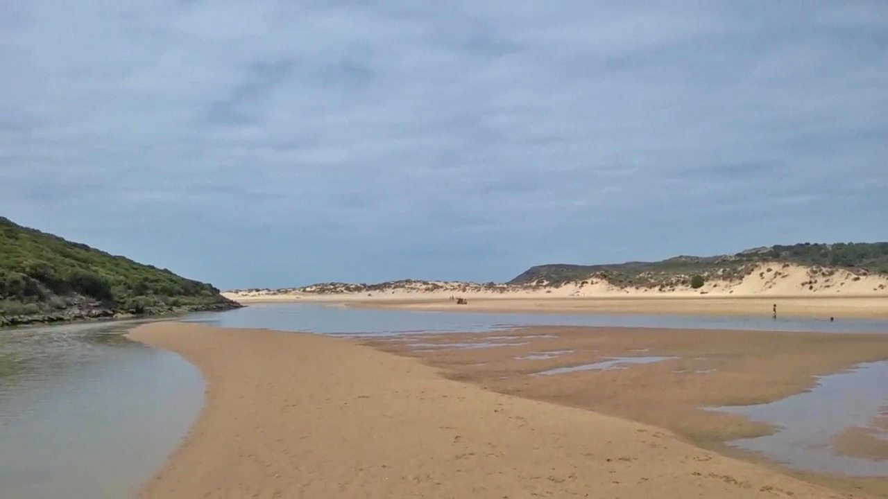 Sand flats and dunes along the Aljezur river at Praia da Amoreira, Algarve, Portugal